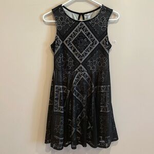 Black/Cream sleeveless dress - Size M.  Black skirt lays over cream inside